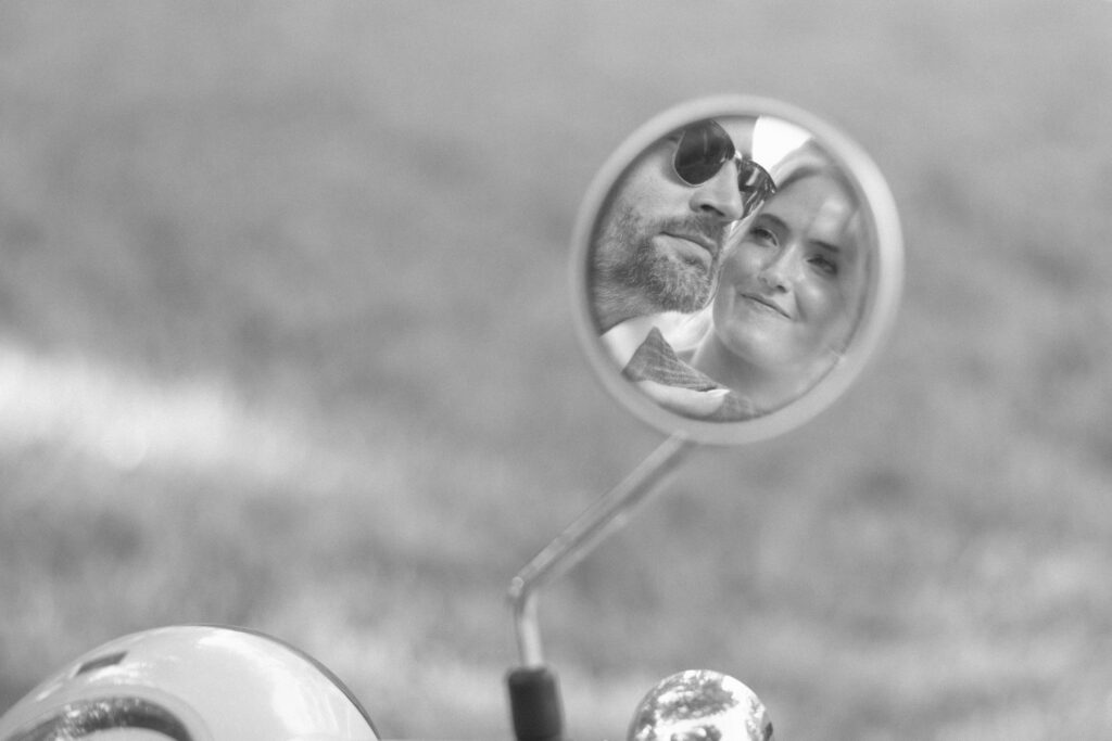 couple seen in a mirror looking at each other 