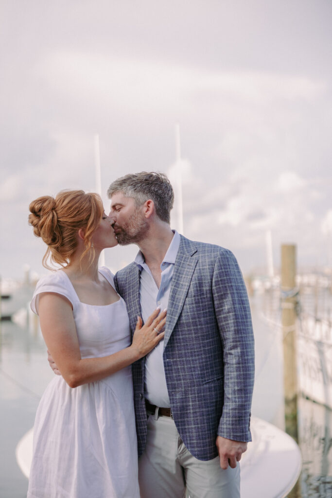 couple kisses in the Garrison Bight Marina