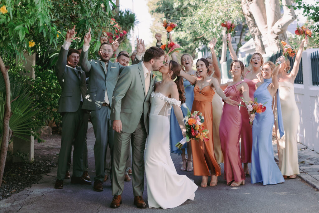 Couple with their bridal party at their dream wedding at the Hemingway House Museum, surrounded by love and joy.