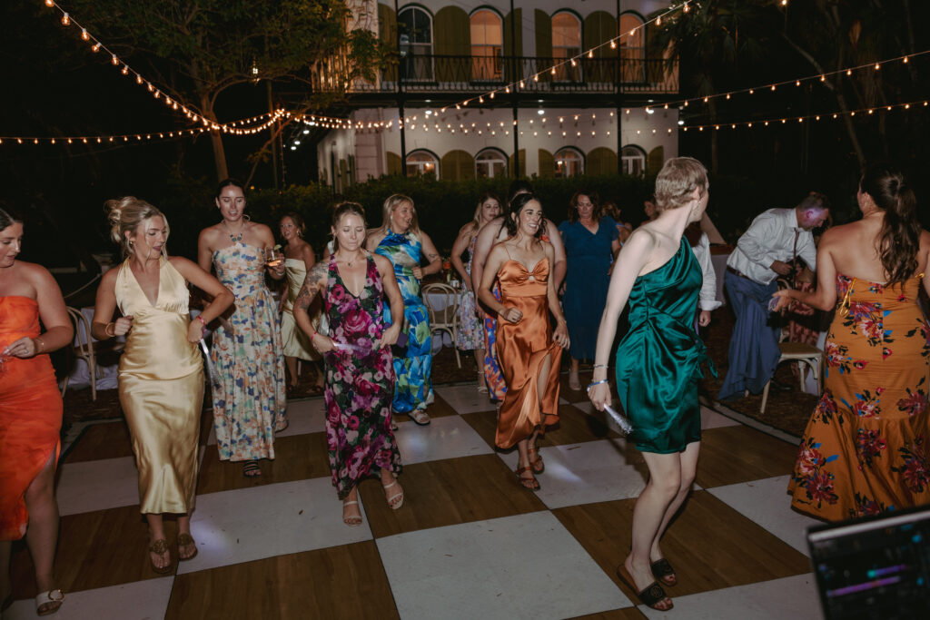 Everyone enjoying a great time dancing at the couple's dream wedding at the Hemingway House Museum.