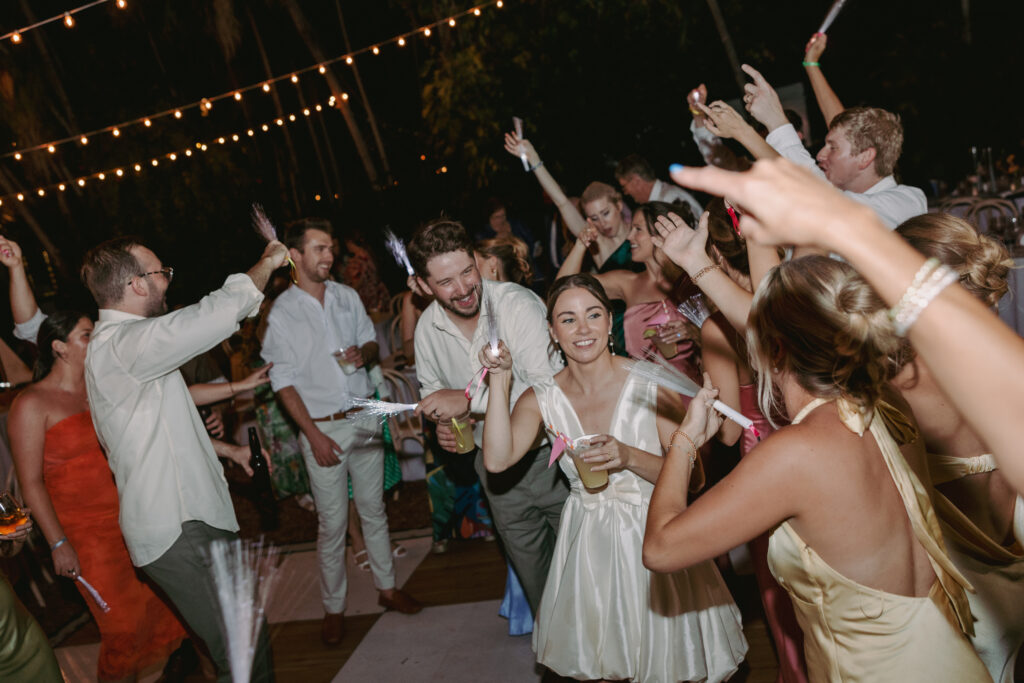 Everyone enjoying a great time dancing with the couple at their dream wedding at the Hemingway House Museum, creating a sweet and memorable moment.