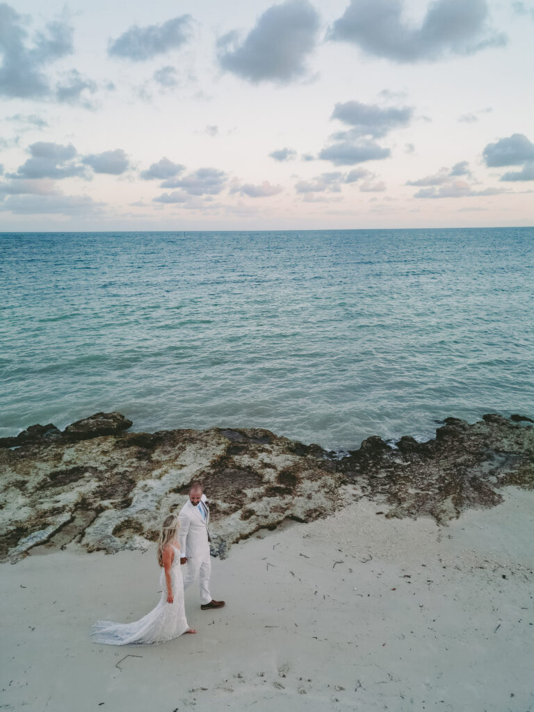 Couple enjoying a timeless romance moment by the sea at Casa Marina