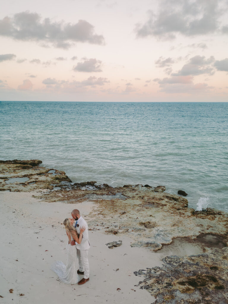 Couple enjoying a timeless romance moment by the sea at Casa Marina