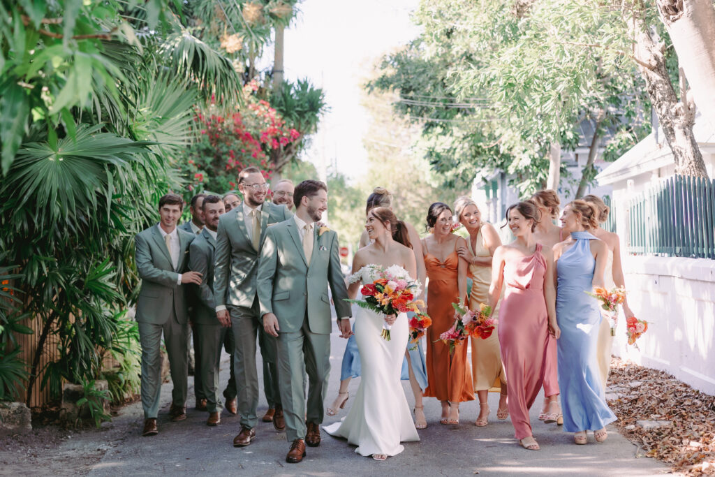 Couple with their bridal party at their dream wedding at the Hemingway House Museum, surrounded by love and joy.
