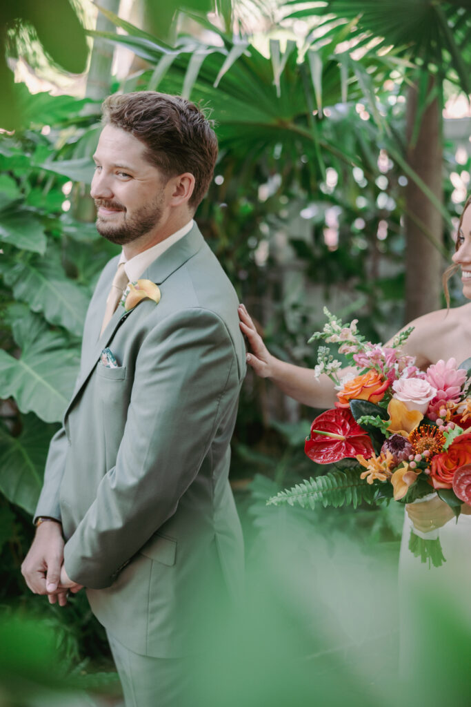 Couple’s first look at their dream wedding at the Hemingway House Museum, capturing an unforgettable moment.