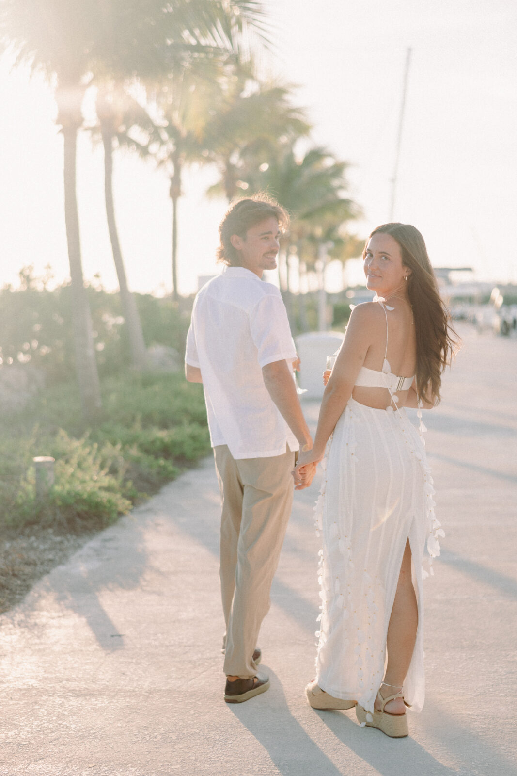 Couple walking hand in hand during their Lifestyle Session in the Florida Keys.