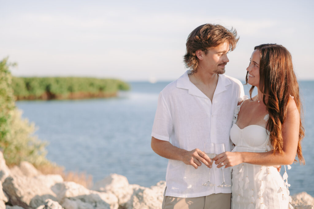 Couple making a toast during their Lifestyle Session in the Florida Keys.