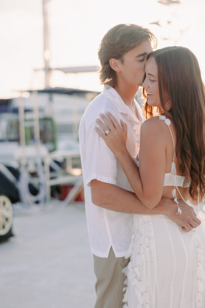 Couple sharing a tender forehead kiss during their Lifestyle Session in the Florida Keys.