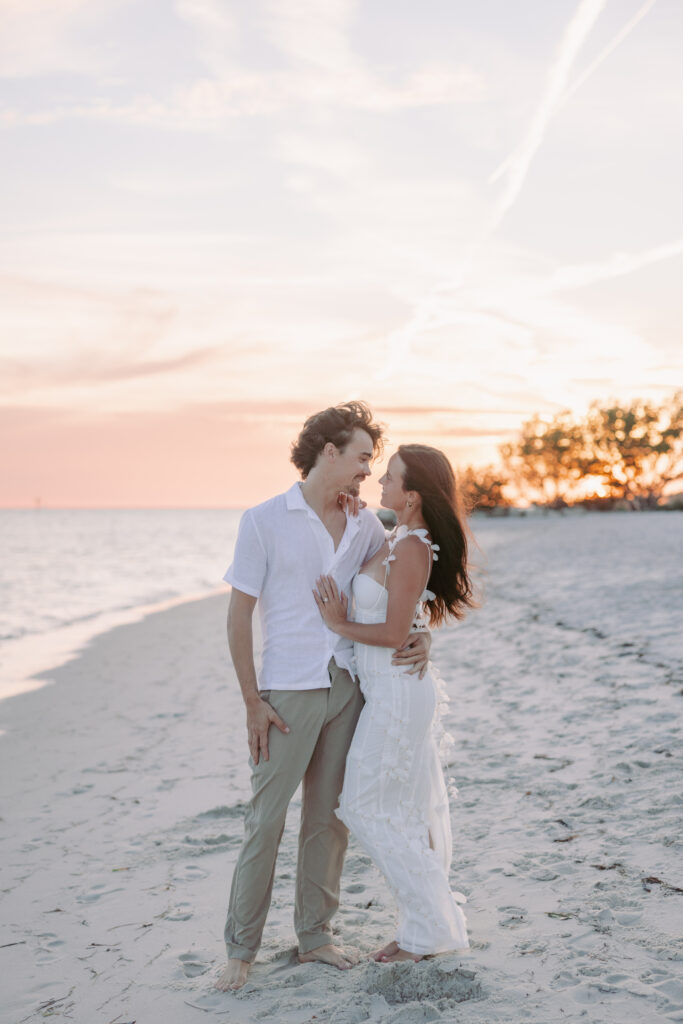 Romantic moment of a couple standing by the shore in their Lifestyle Session in the Florida Keys.