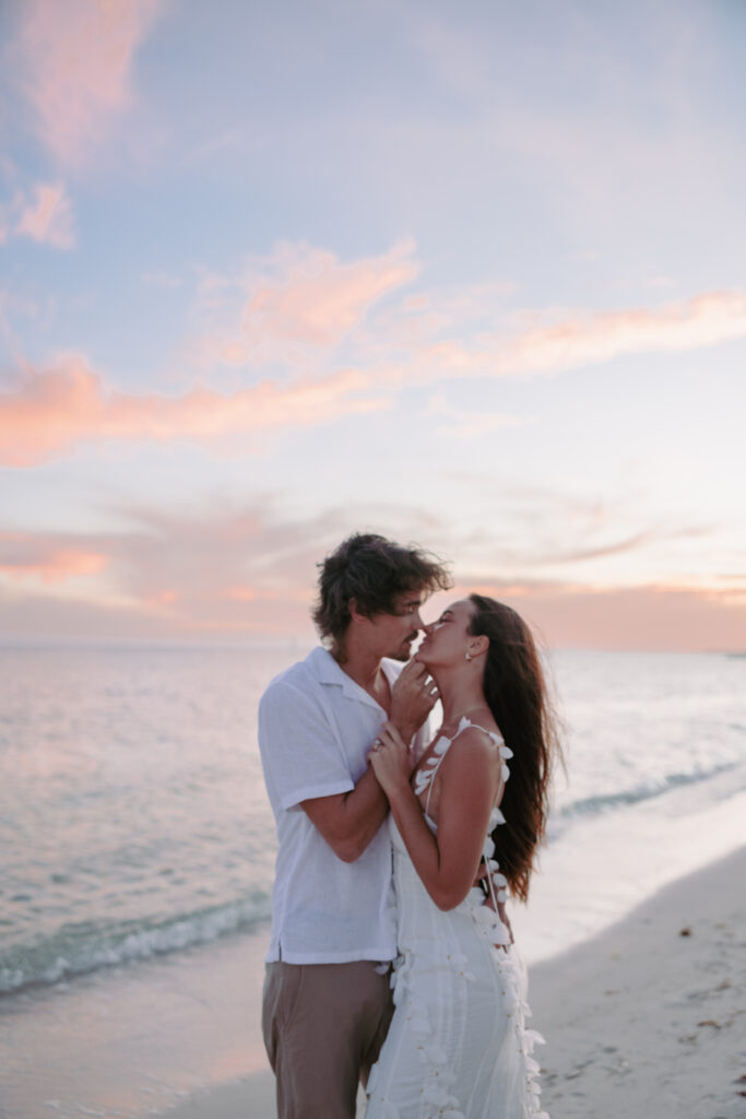 Couple sharing a kiss on the shoreline during their Lifestyle Session in the Florida Keys.