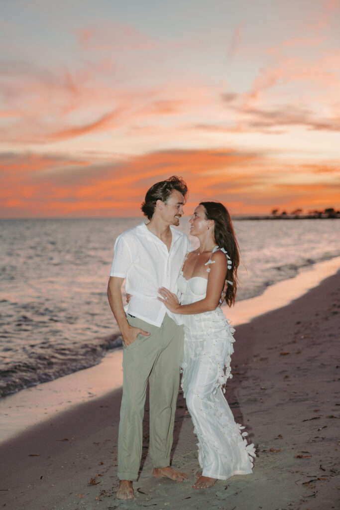 Couple's romantic sunset moment by the shoreline during a Lifestyle Session in the Florida Keys.