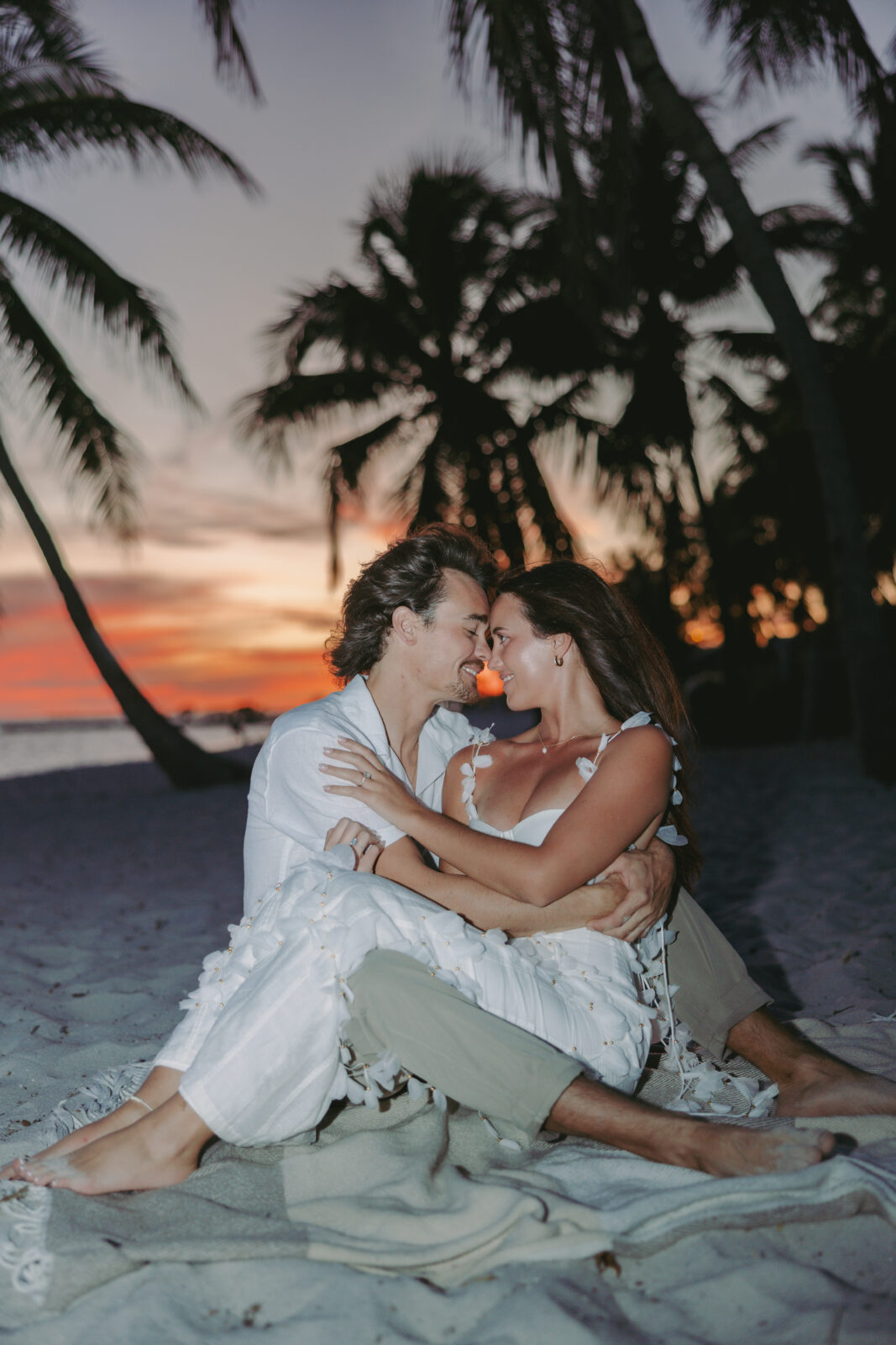 Couple's romantic sunset moment by the shoreline during a Lifestyle Session in the Florida Keys.