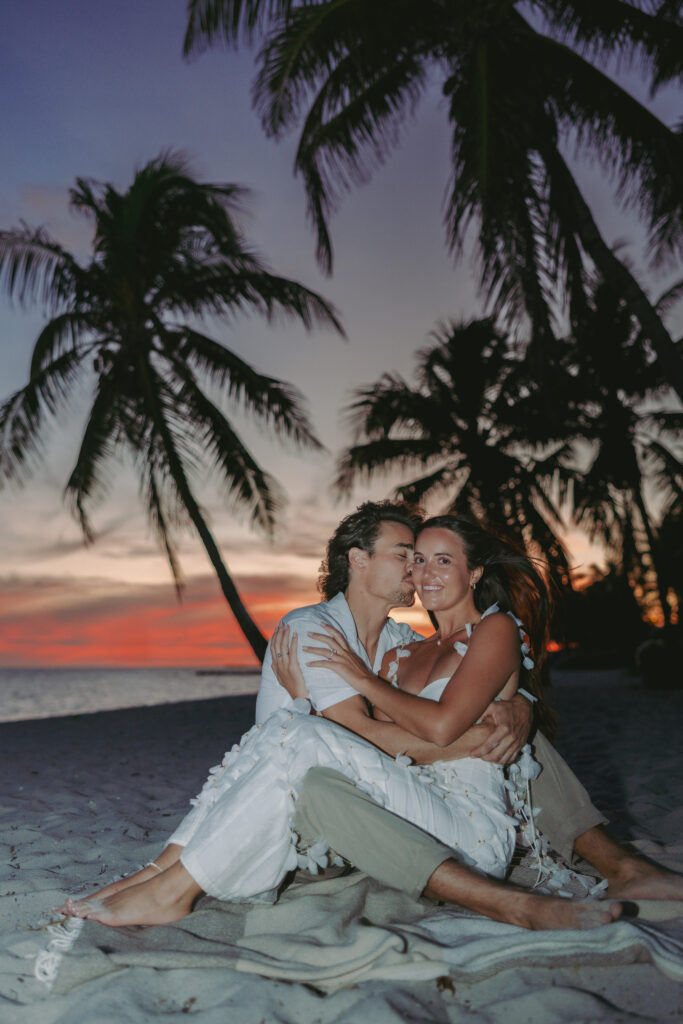 Couple's romantic sunset moment by the shoreline during a Lifestyle Session in the Florida Keys.
