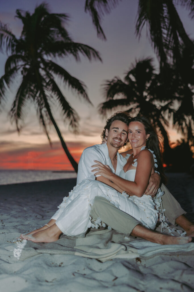 Couple's romantic sunset moment by the shoreline during a Lifestyle Session in the Florida Keys.