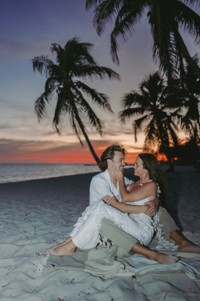 Couple's romantic sunset moment by the shoreline during a Lifestyle Session in the Florida Keys.