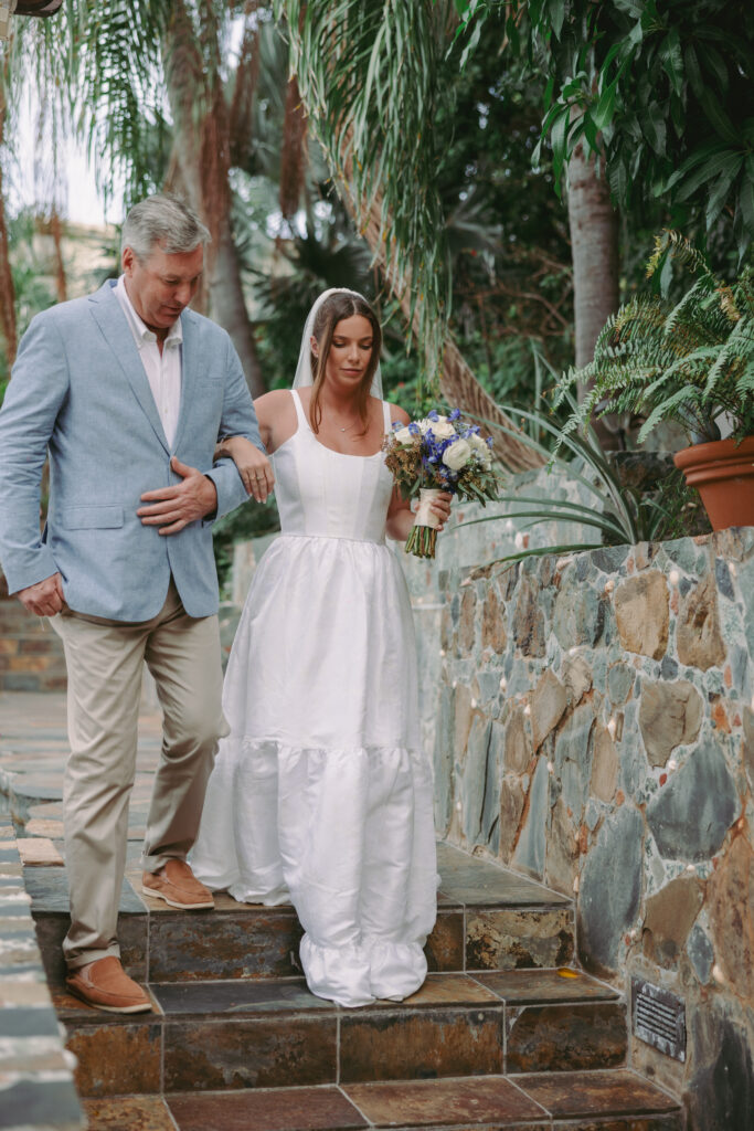 Father walking bride down the steps