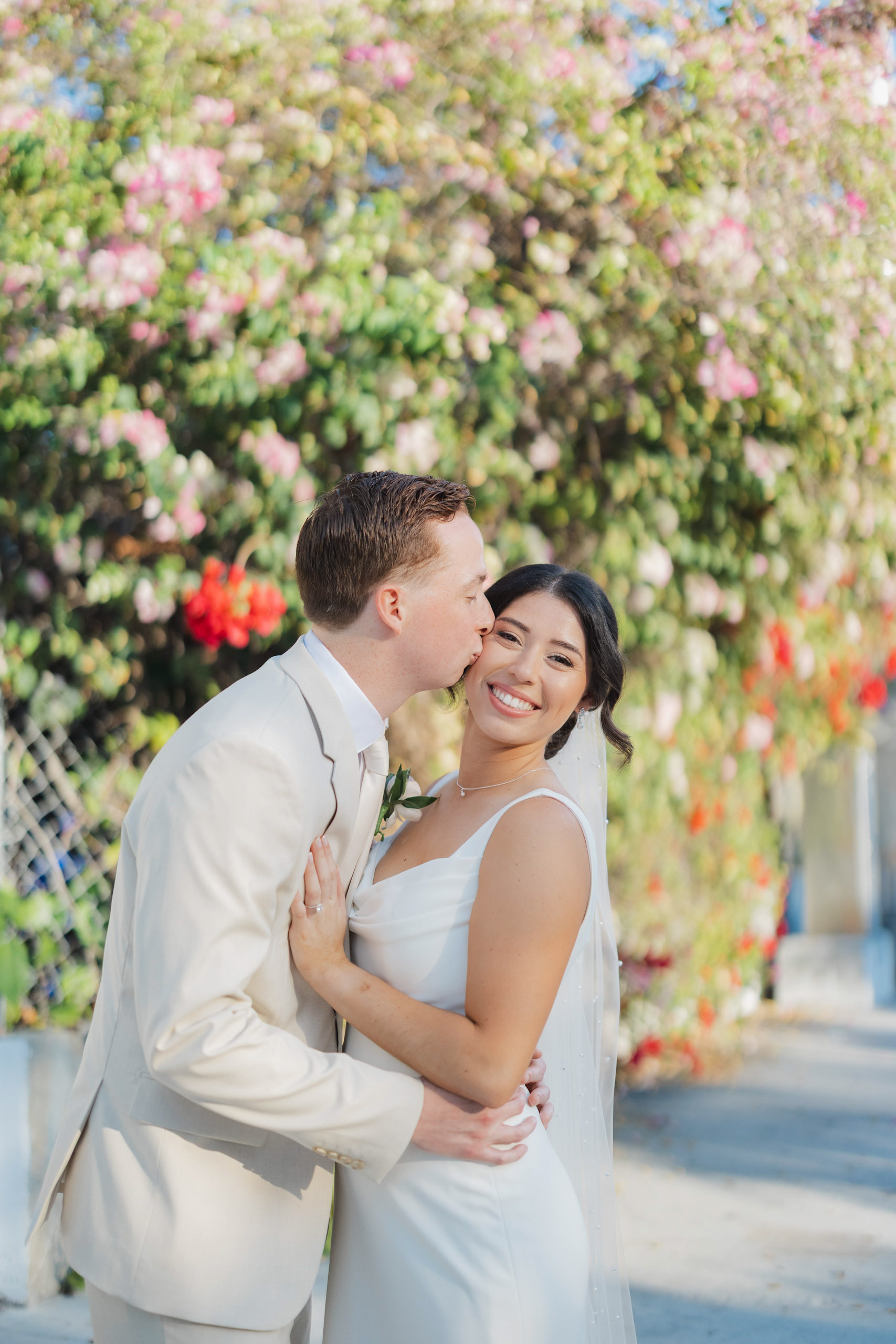 Bride and groom share a kiss during their Key West wedding photos