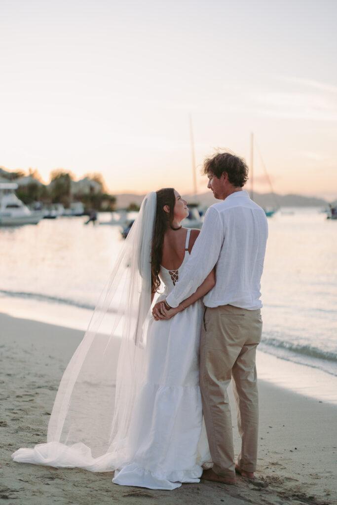 Bride and groom looking at each other as the sunsets after their St John USVI wedding