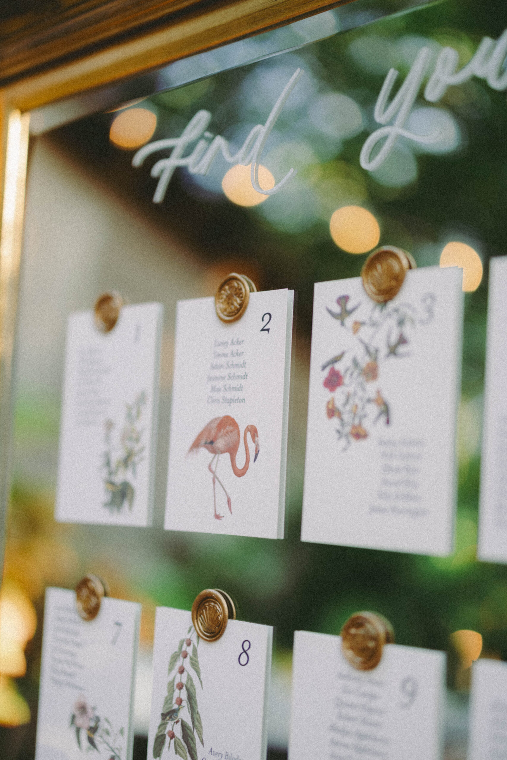 Tropical themed seating chart at an outdoor Key West wedding.