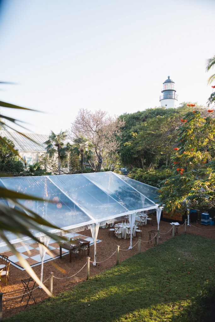 The Hemingway House outdoor reception area with the Lighthouse in the background.