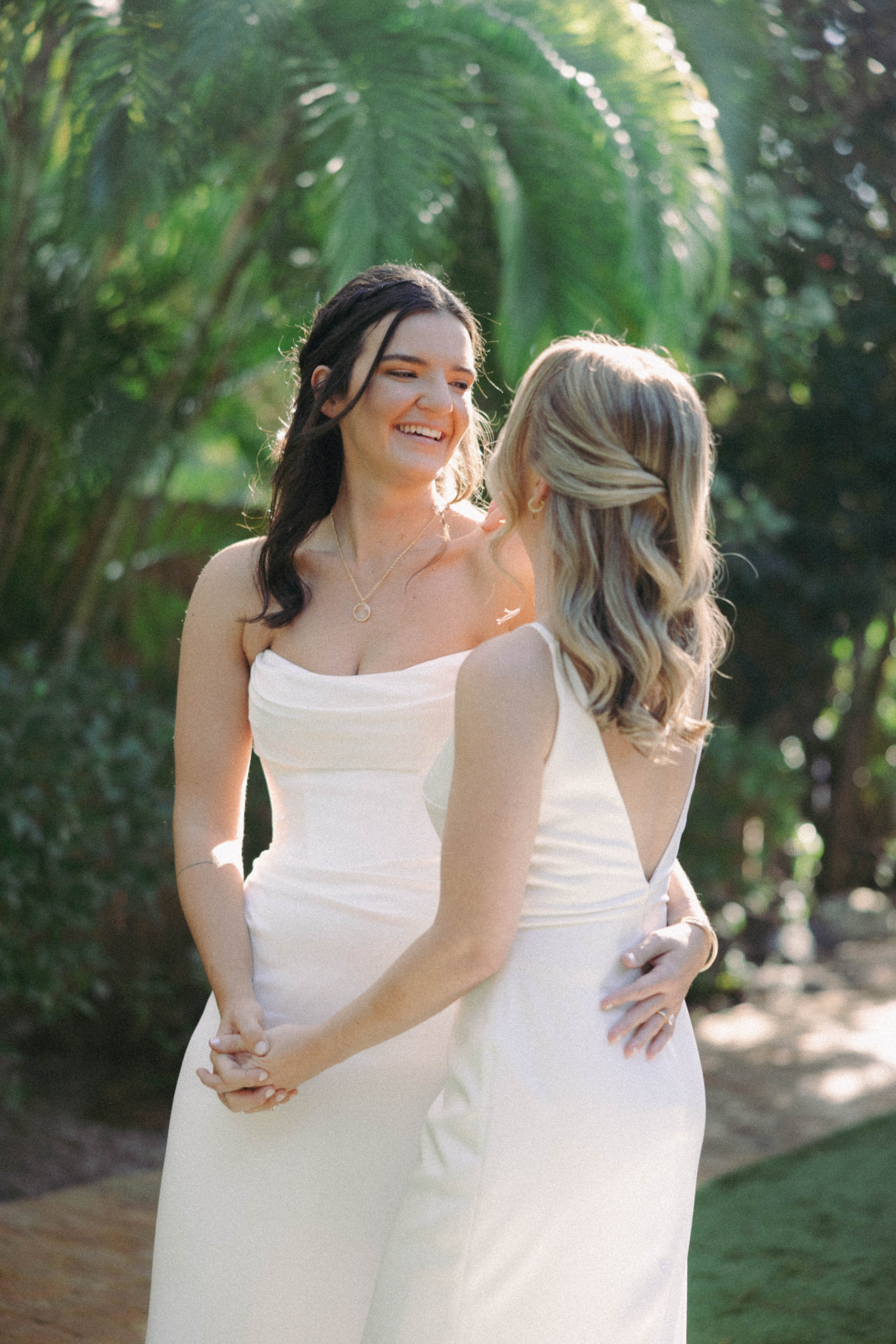 Film photograph of bride and bride in the Audubon House garden, Key West
