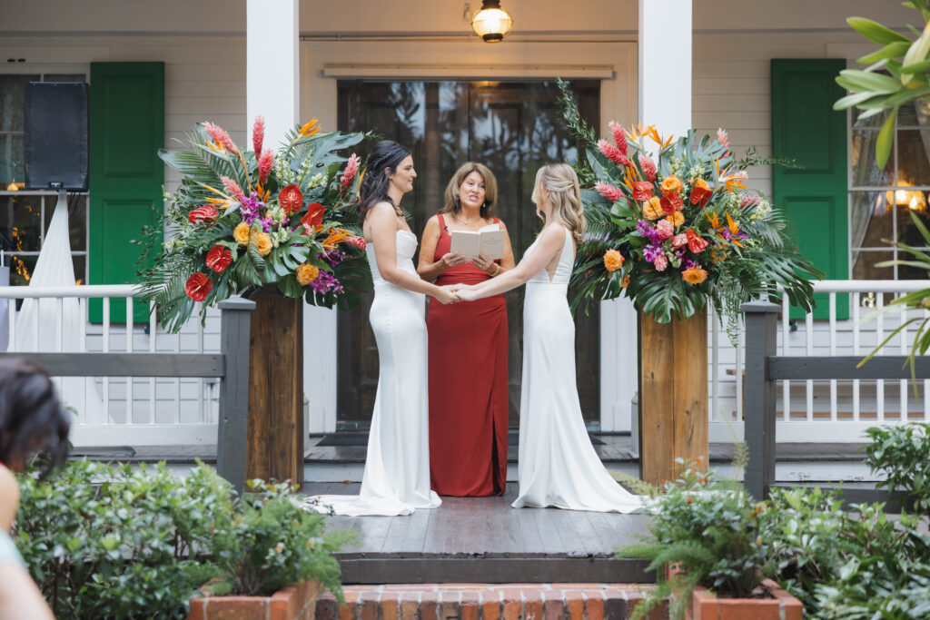 Film photograph of bride and bride in the Audubon House garden, Key West