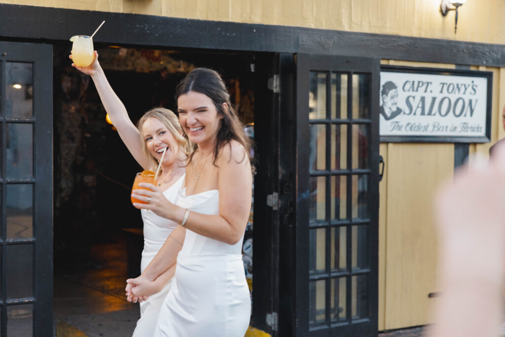 The brides stop for a quick drink before their Key West wedding