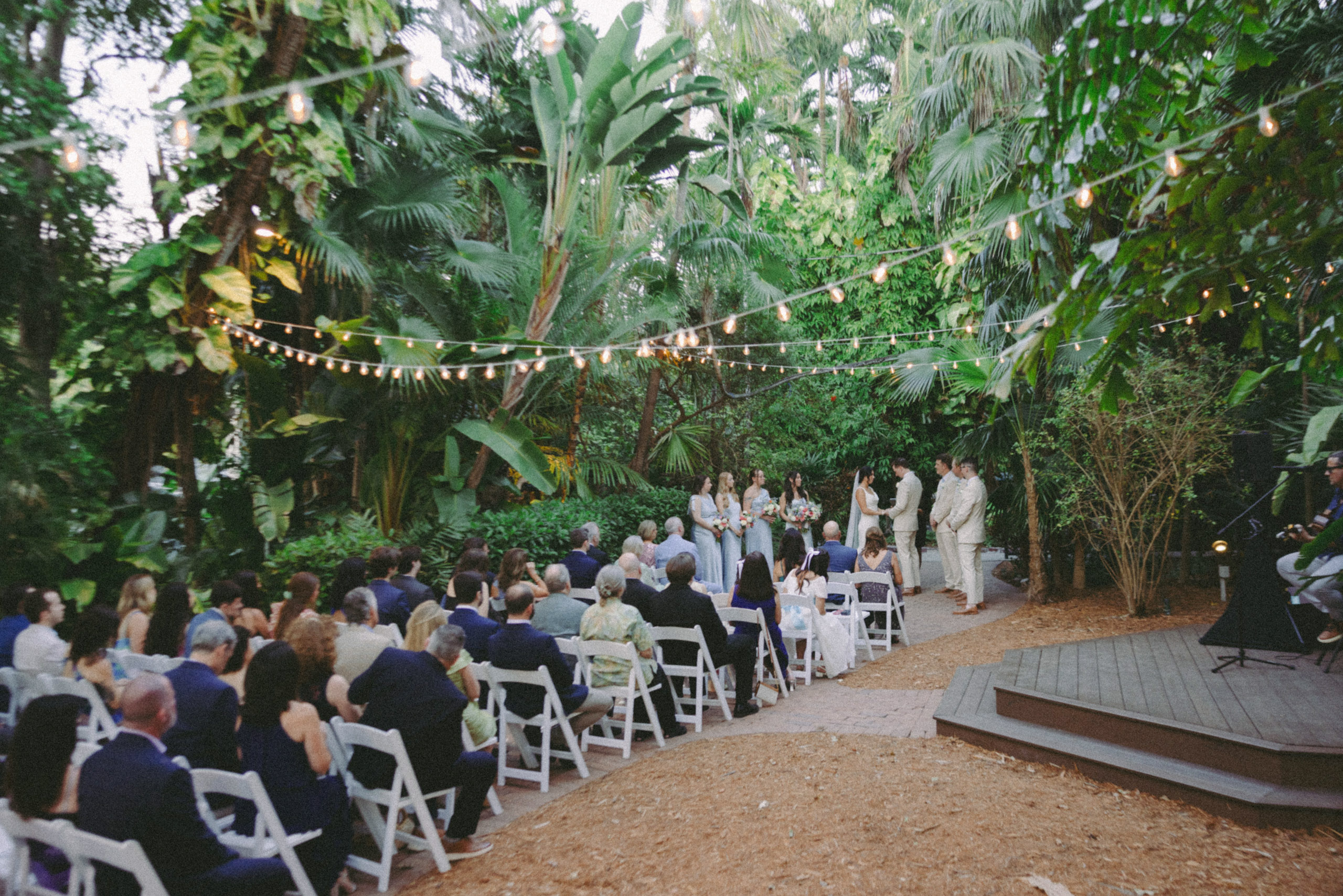 Bride and groom exchanging vows during their wedding at the historic Hemingway House wedding venue, captured on film