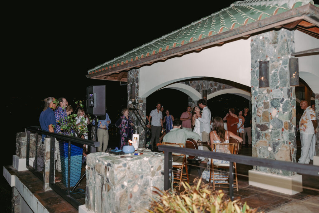Villa reception at night with the harbor and anchored sailboat in view