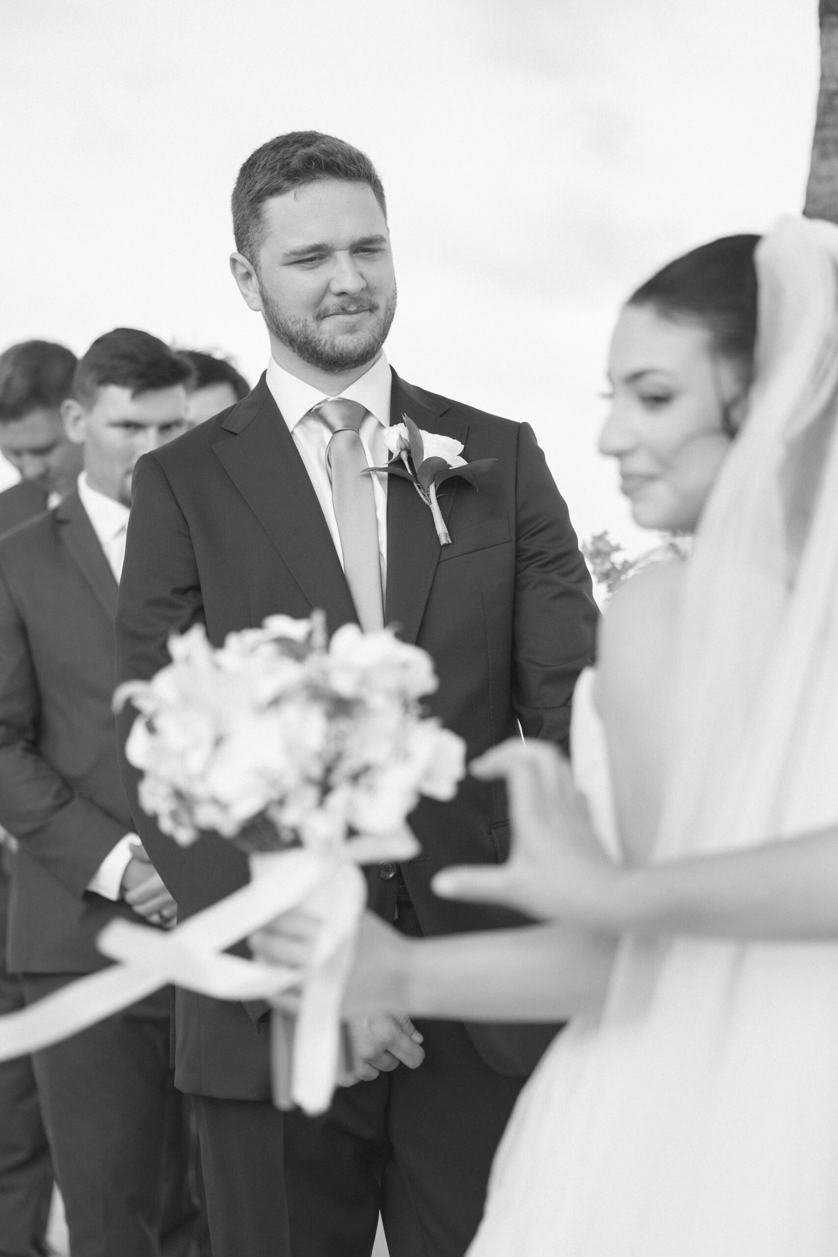 Bride and groom exchanging vows on the beach during their Cheeca Lodge wedding ceremony