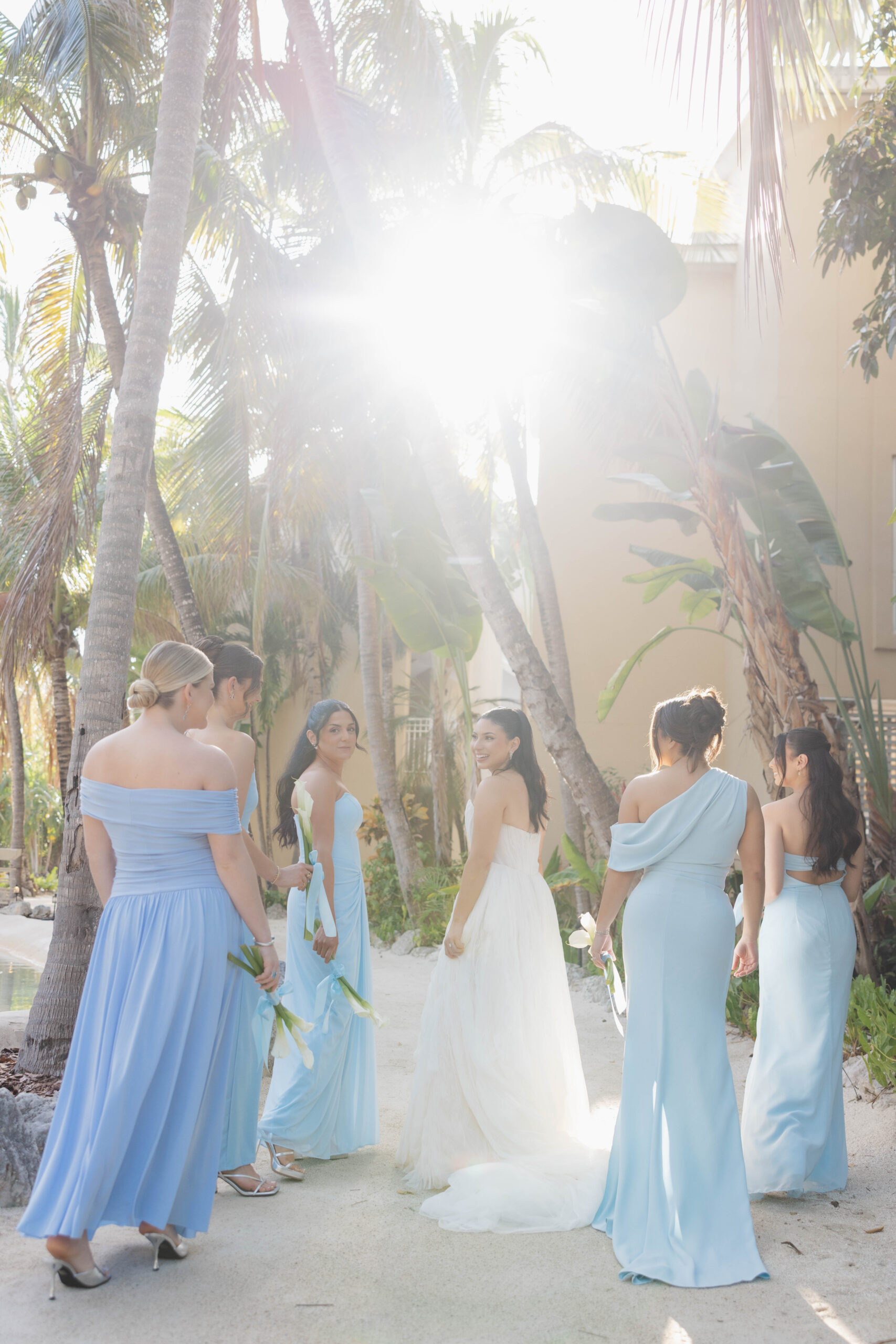 Bride and her bridesmaids in light blue dresses before her Cheeca Lodge wedding ceremony
