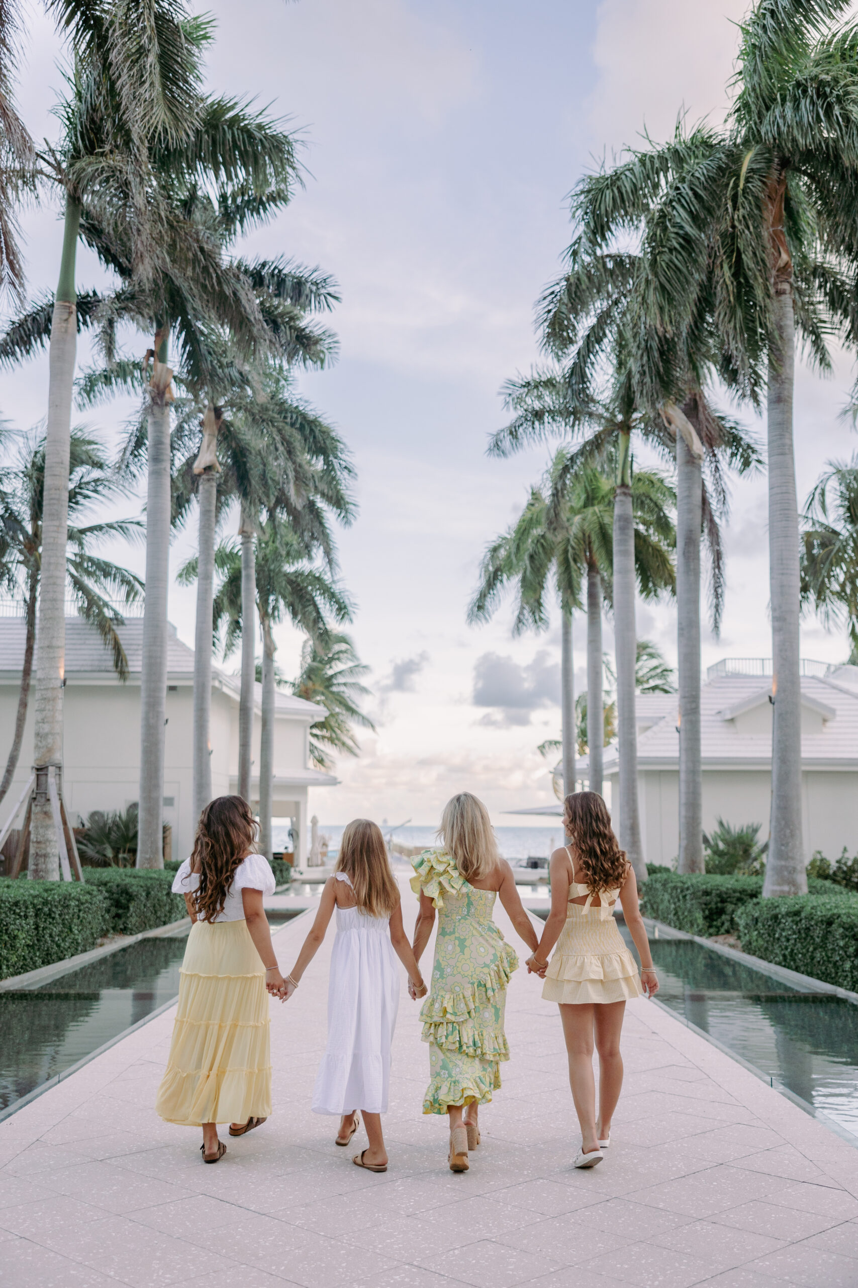 Family walking together at golden hour at a Key West resort during a lifestyle session