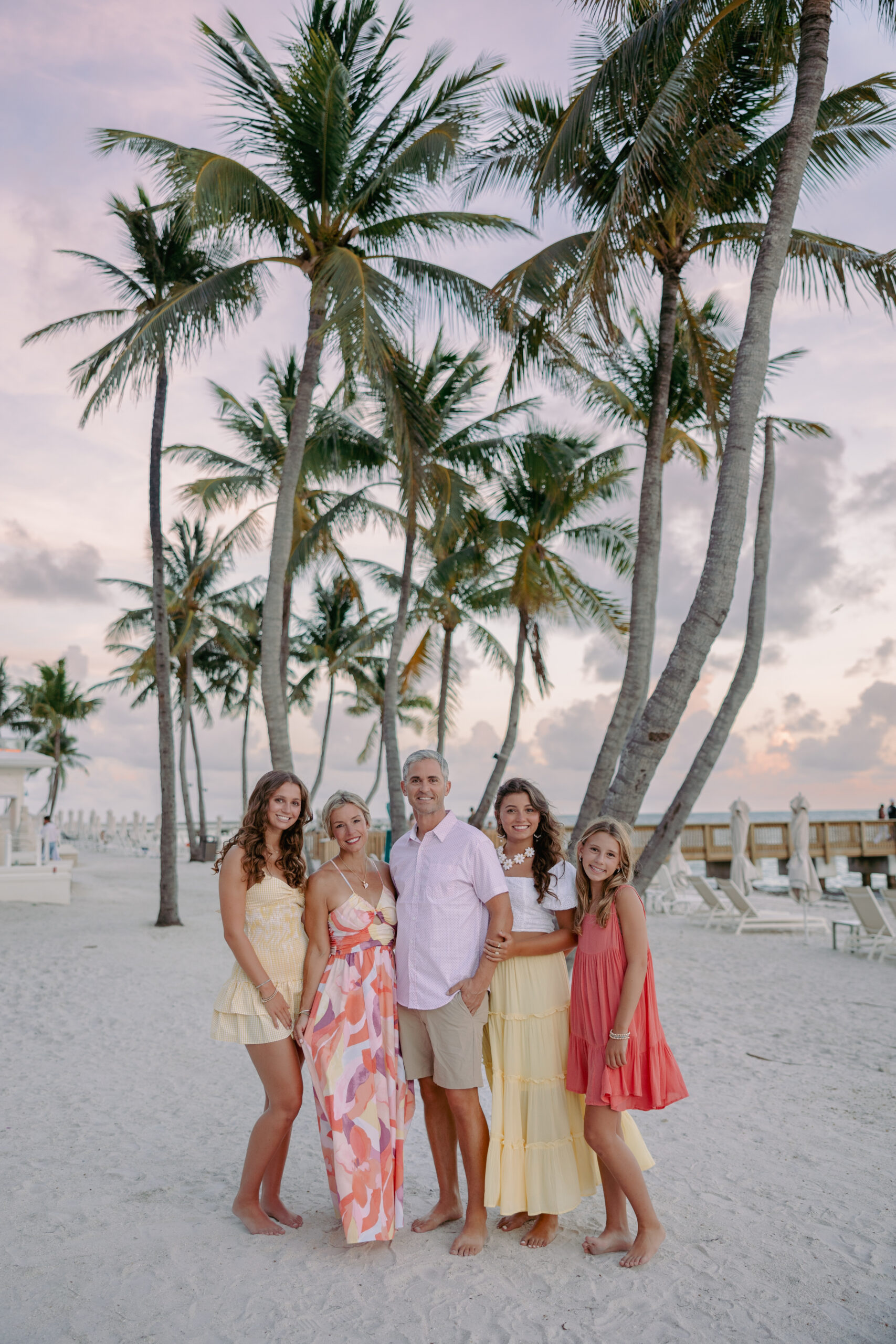 Family walking together at golden hour at a Key West resort during a lifestyle session