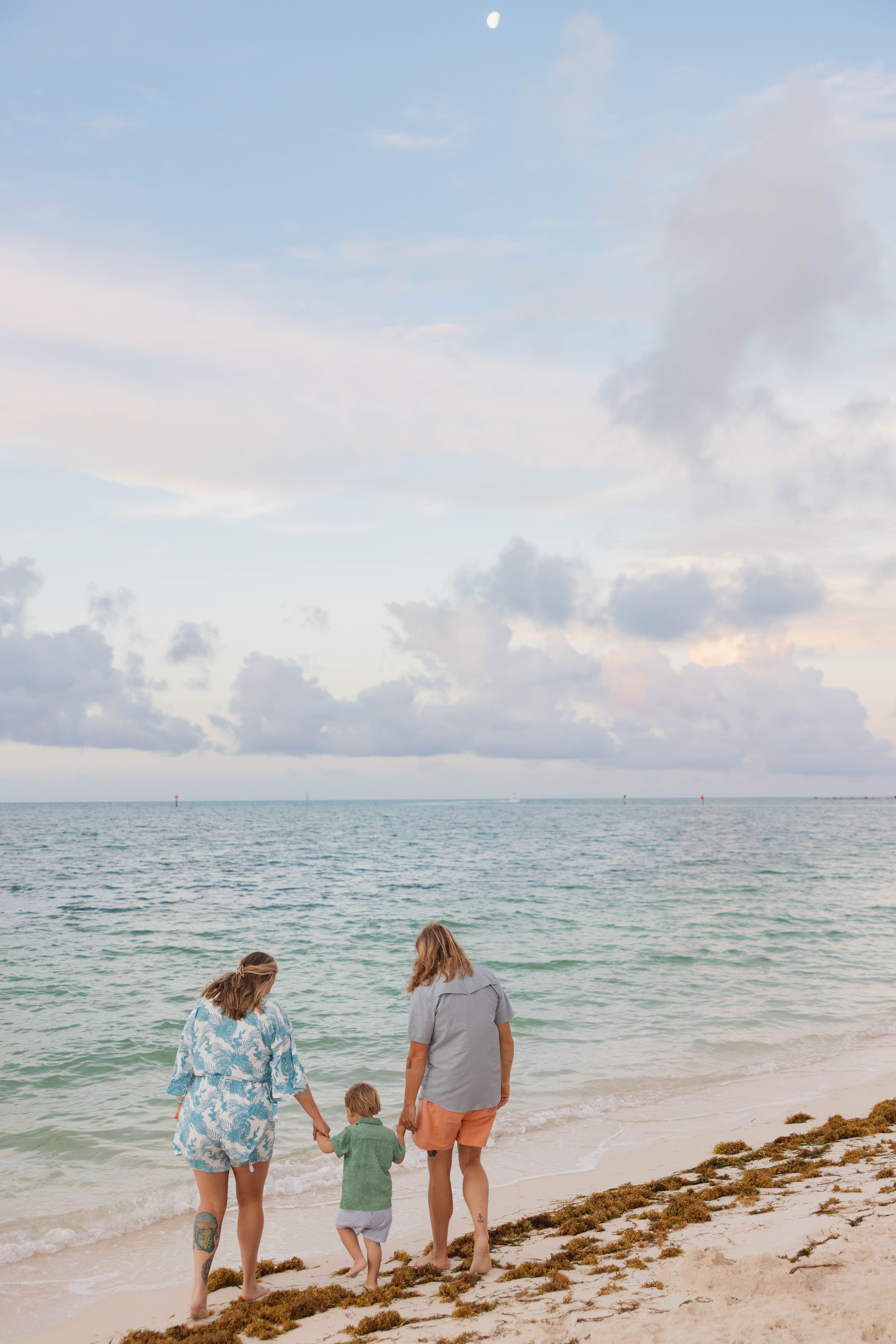 Key West family photographer candidly capturing a family on the beach