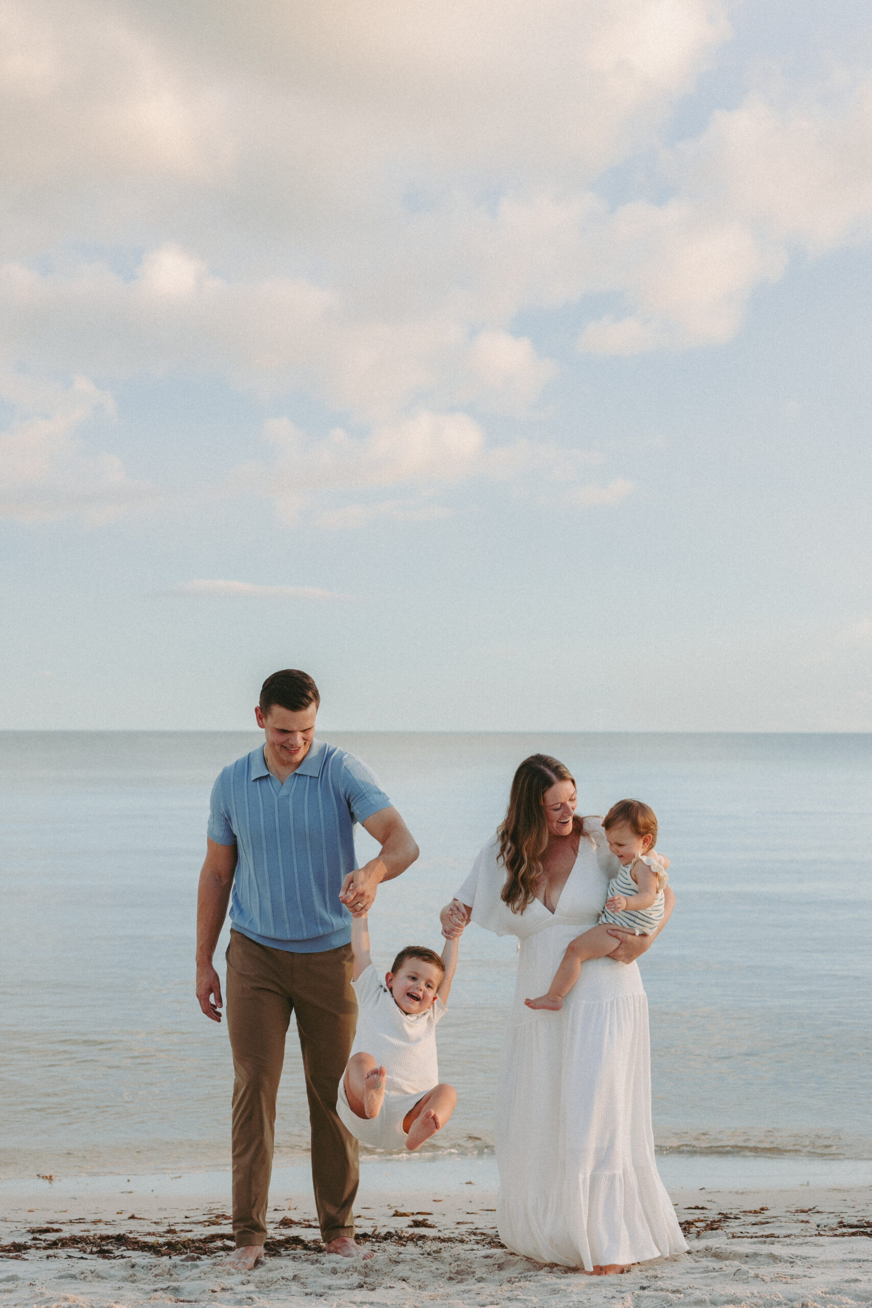 Key West family photographer candidly capturing a family on the beach