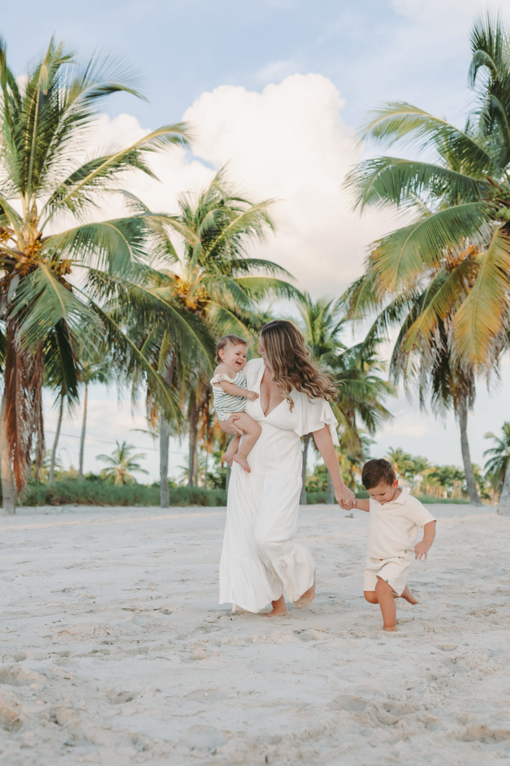 Key West family photographer candidly capturing a family on the beach