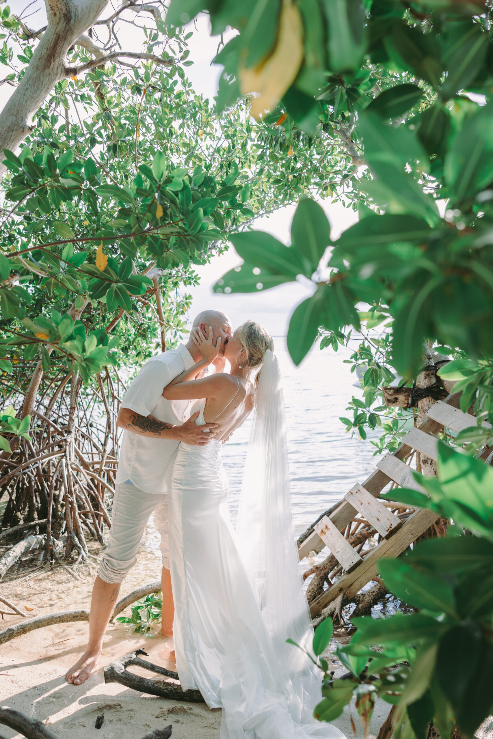 Couple kissing on a private during a key west sandbar photo session