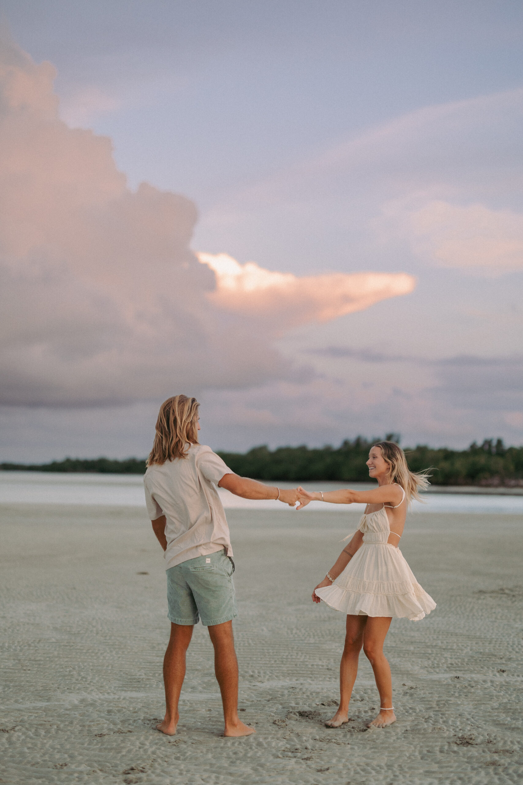 Couple dancing on the beach during a Key West sunset sandbar session