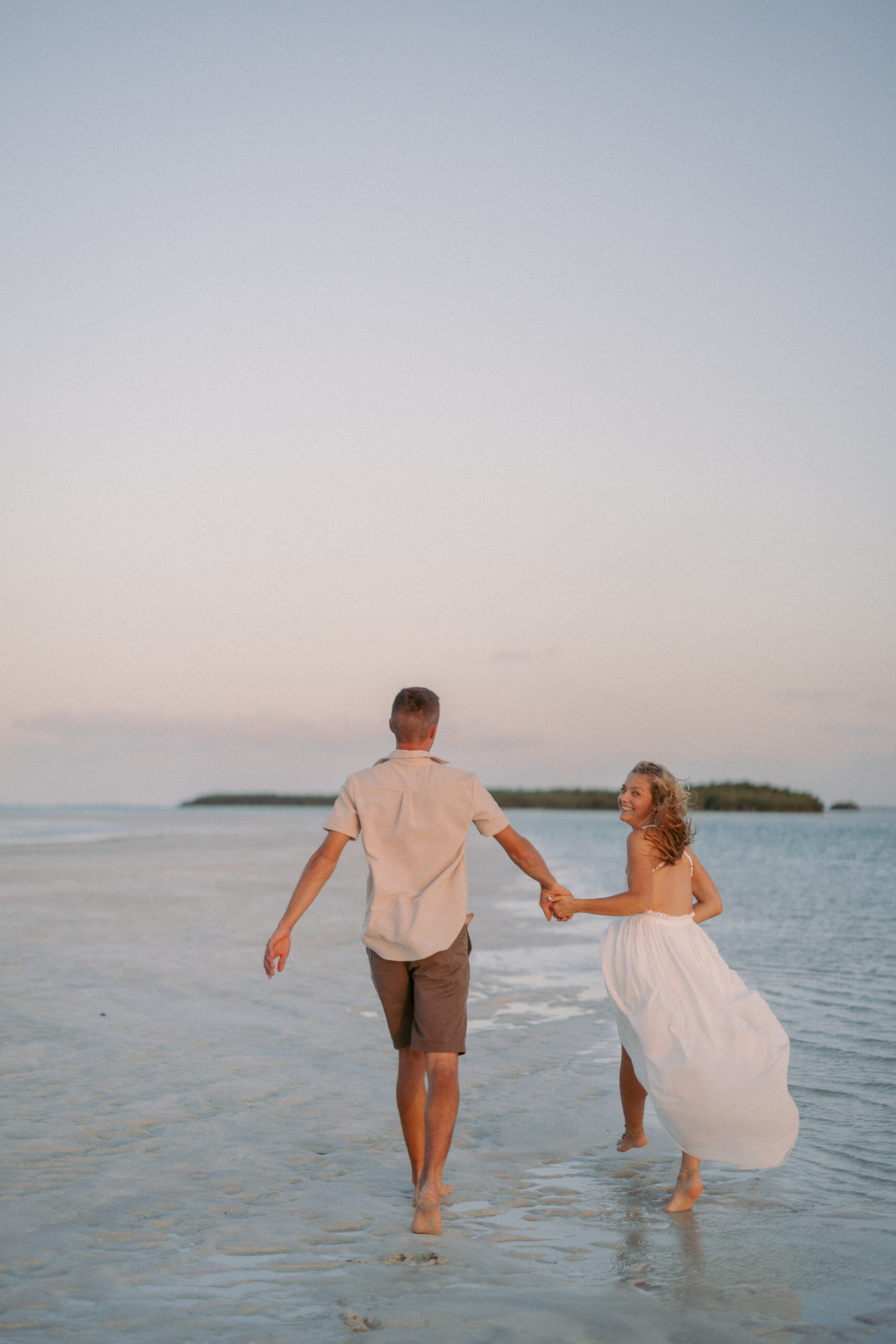 Couple wading at a private sandbar during a Key West sunset sandbar session