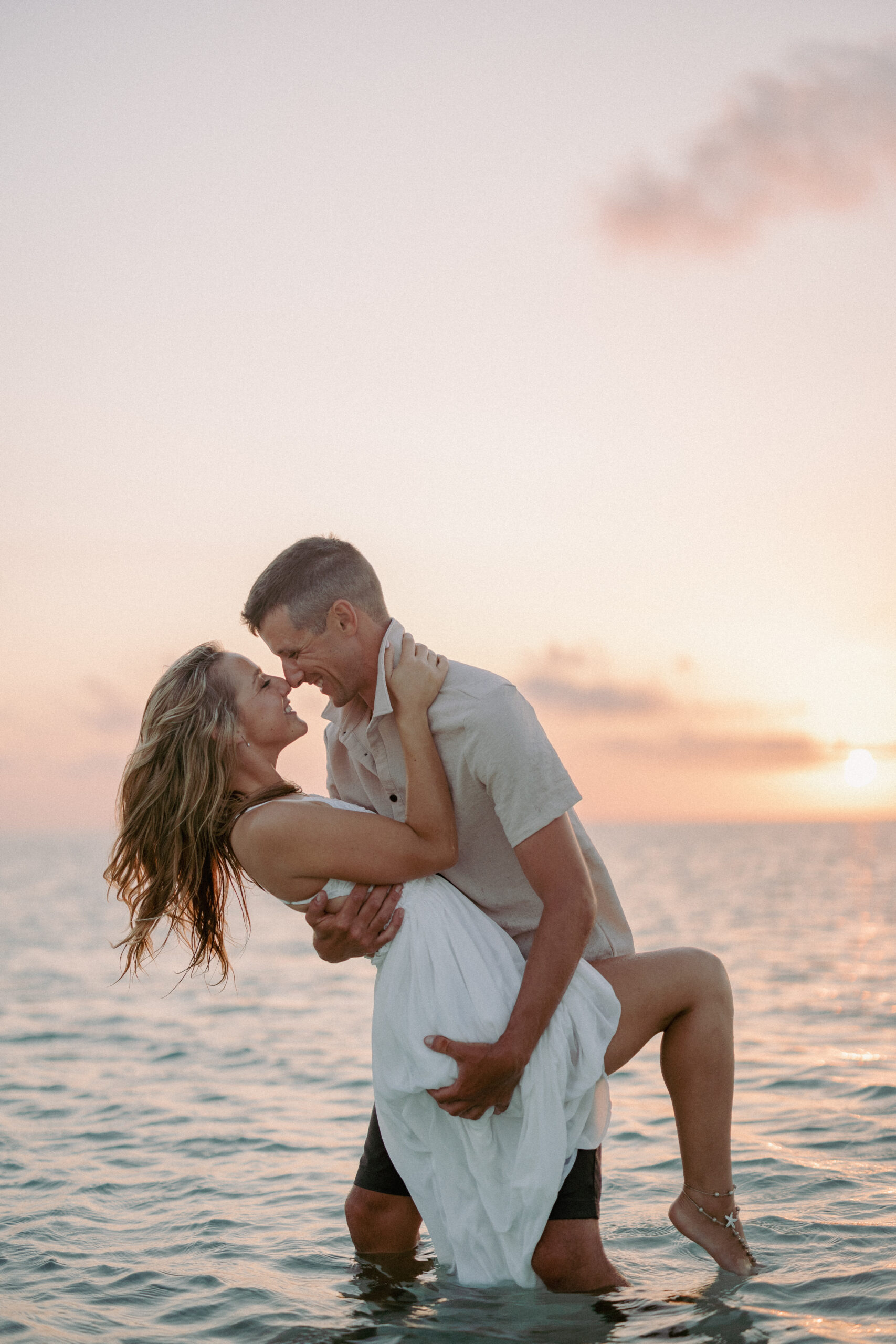 Couple wading at a private sandbar during a Key West sunset sandbar session