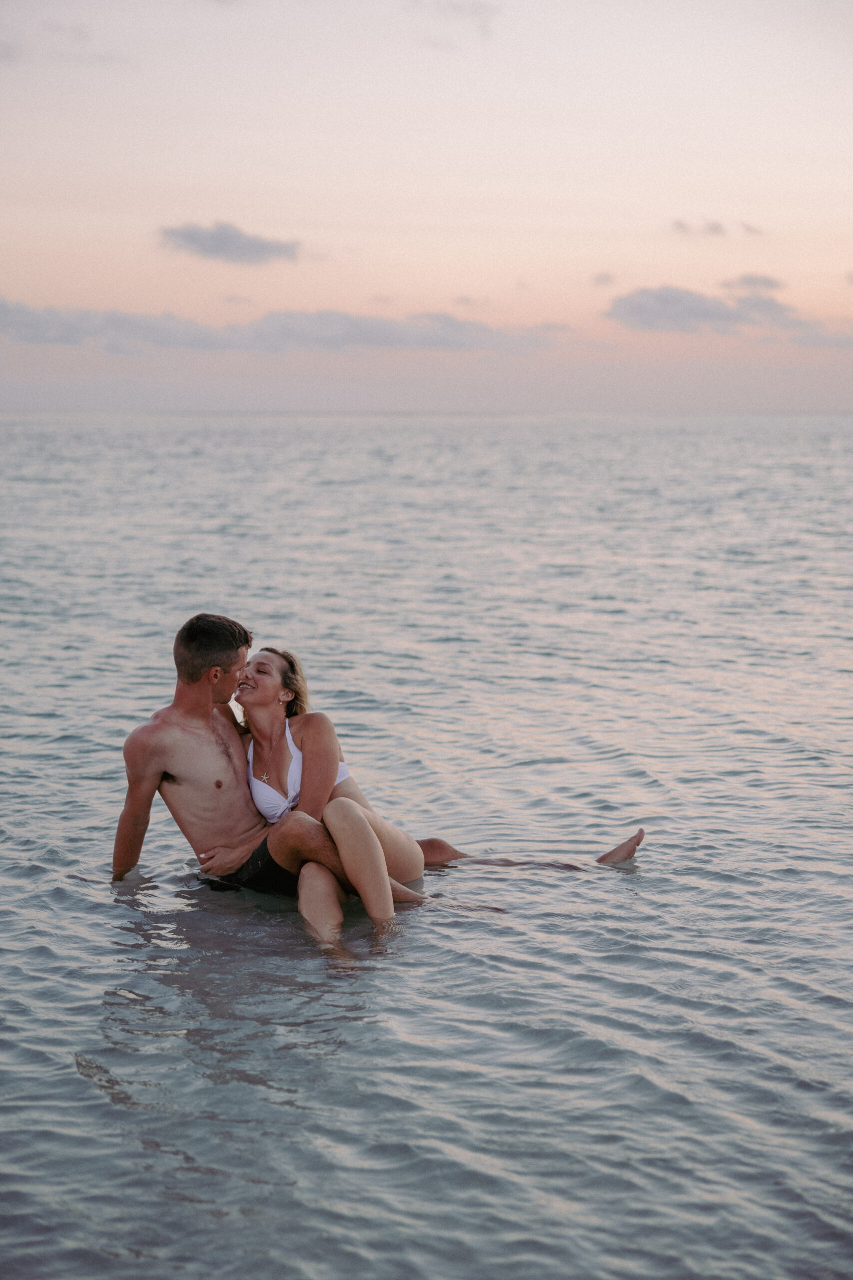 Couple wading at a private sandbar during a Key West sandbar session