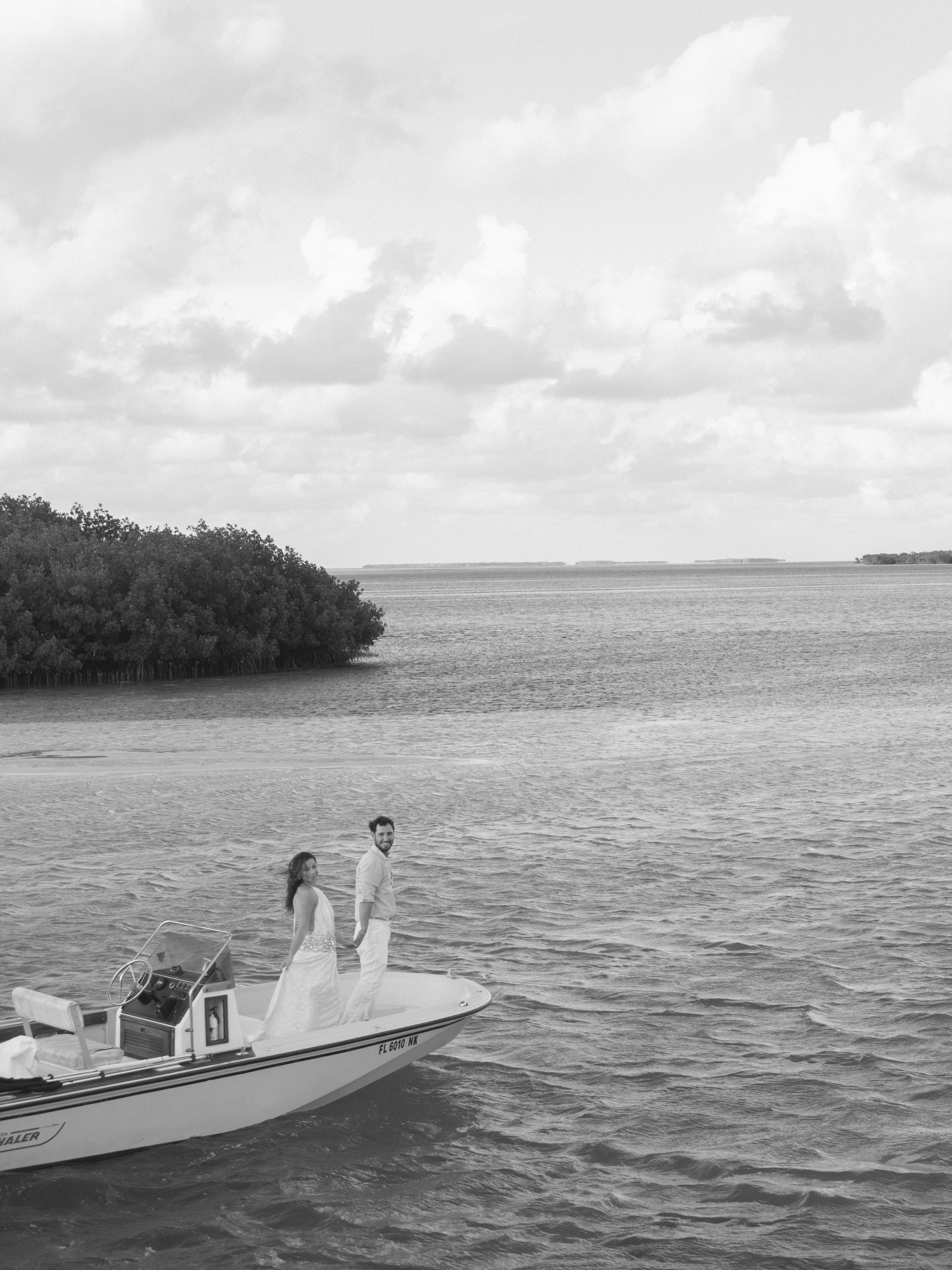 Private charter boat crossing the backcountry waters of the Florida Keys at golden hour