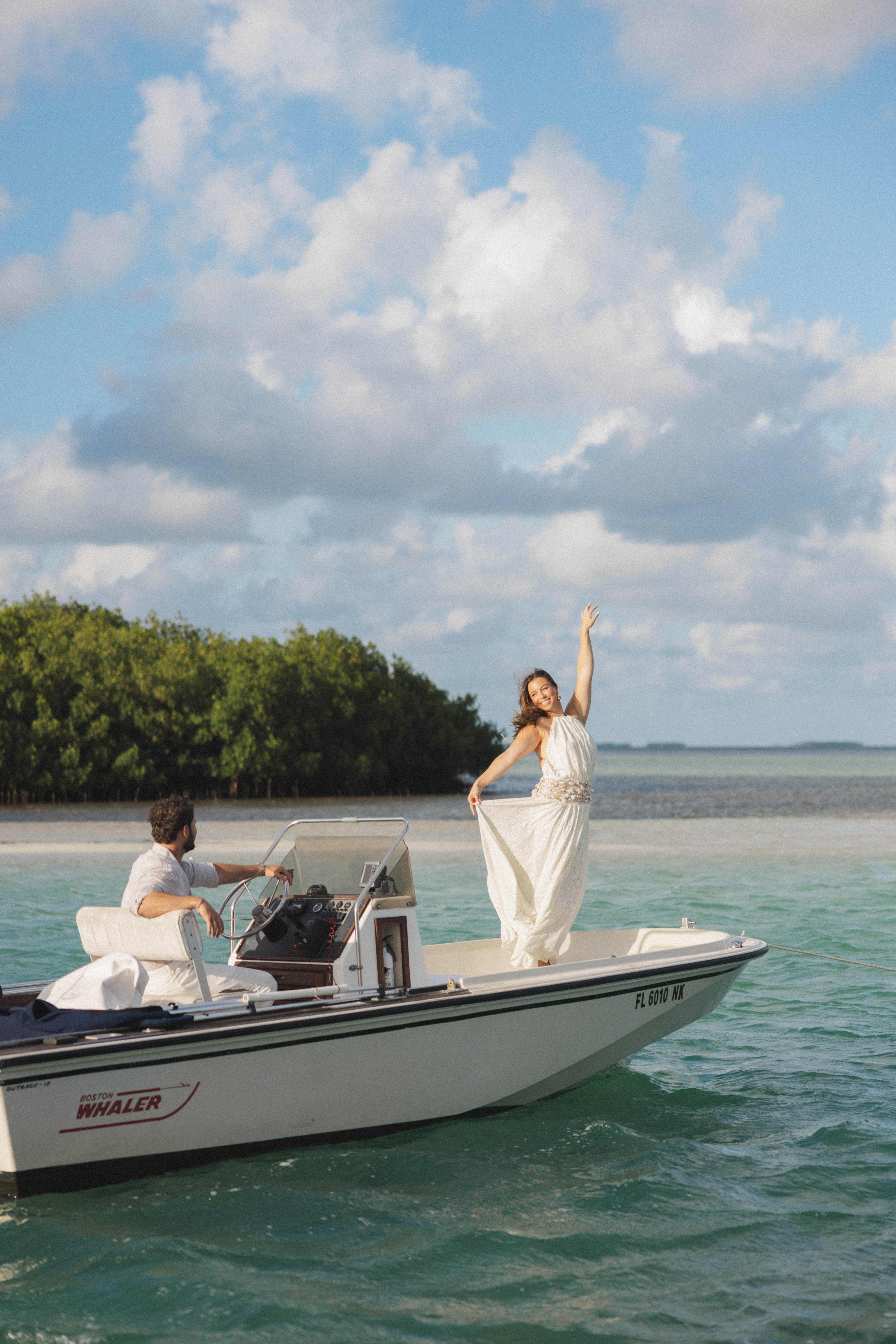 Private charter boat crossing the backcountry waters of the Florida Keys at golden hour